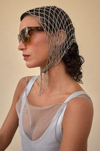 woman wearing chain woven bandana with sunglasses.